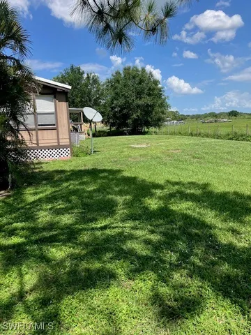 a view of a house with a big yard