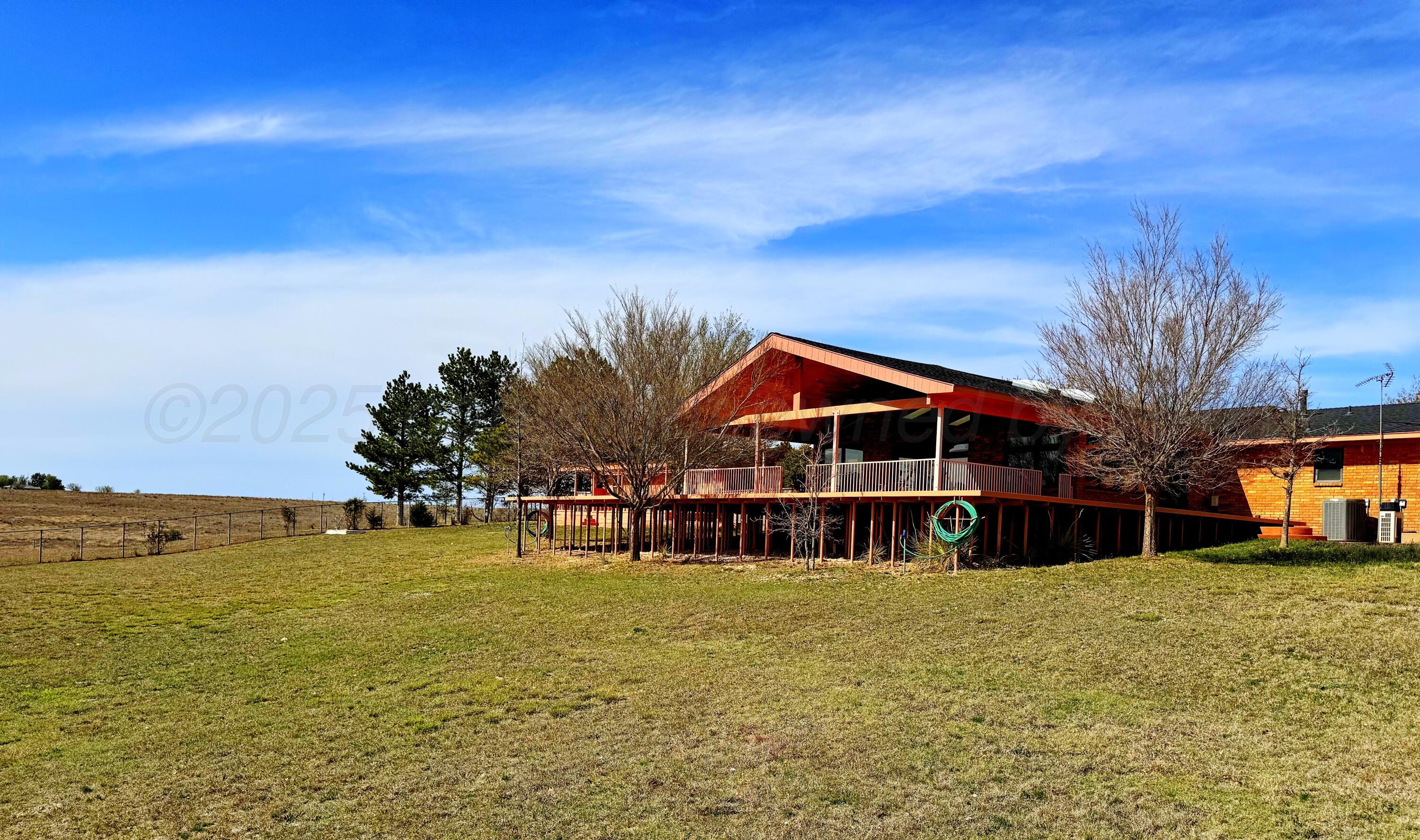 12885 Highway 83 Perryton, TX 79070 - Photo 23 of 40 a front view of a house with a yard