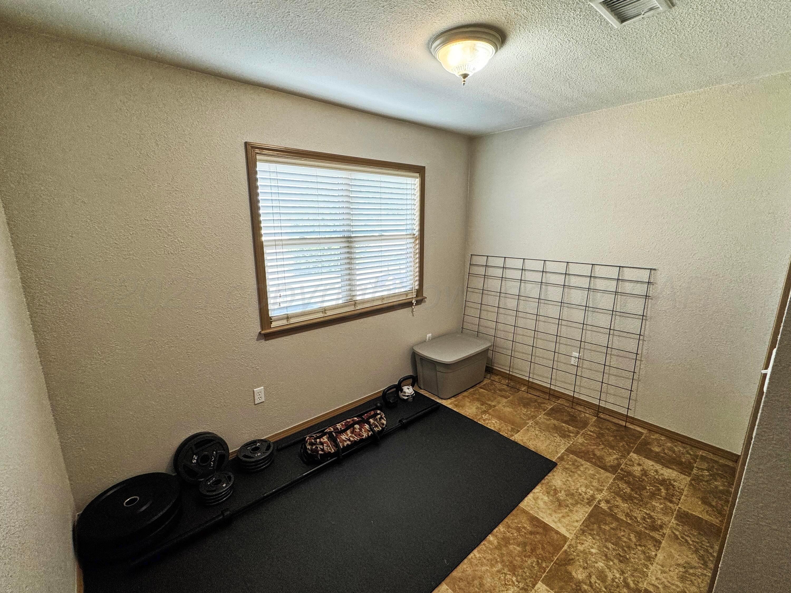 12885 Highway 83 Perryton, TX 79070 - Photo 32 of 40 a view of an empty room and a window