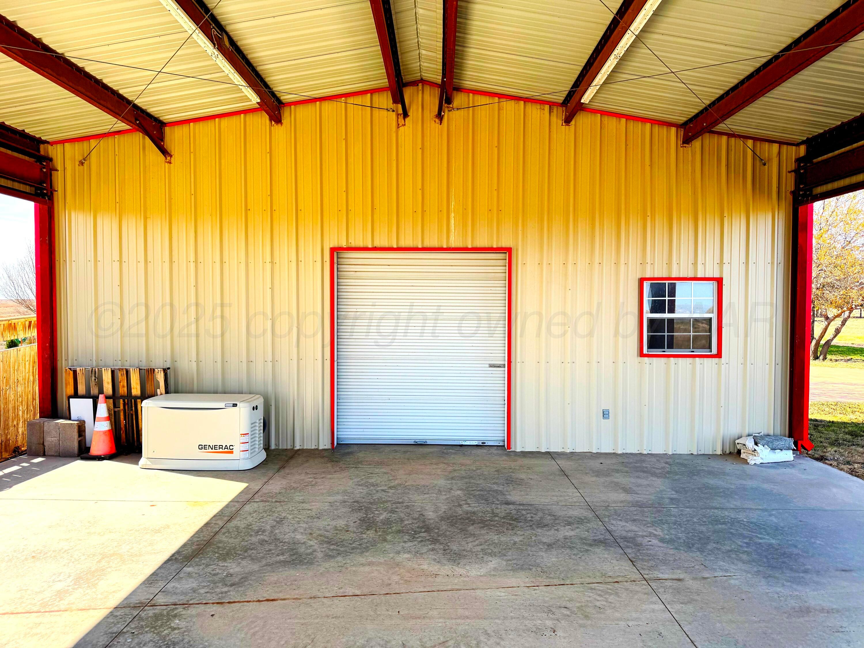 12885 Highway 83 Perryton, TX 79070 - Photo 35 of 40 a view of a room with a window and chandelier
