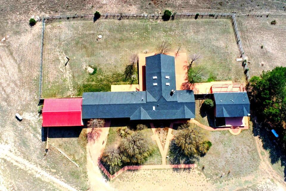 12885 Highway 83 Perryton, TX 79070 - Photo 39 of 40 an aerial view of a house with a yard