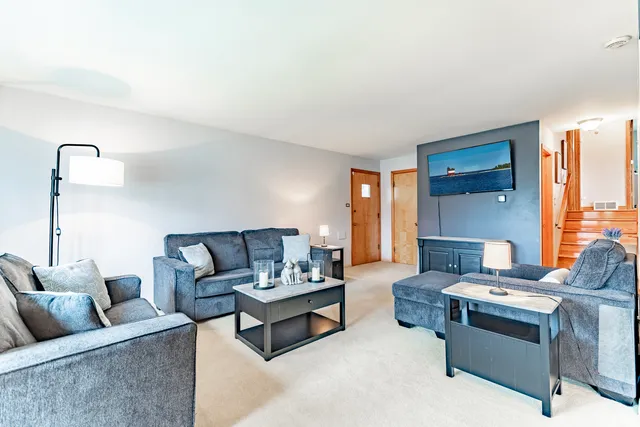 a living room with furniture and a table