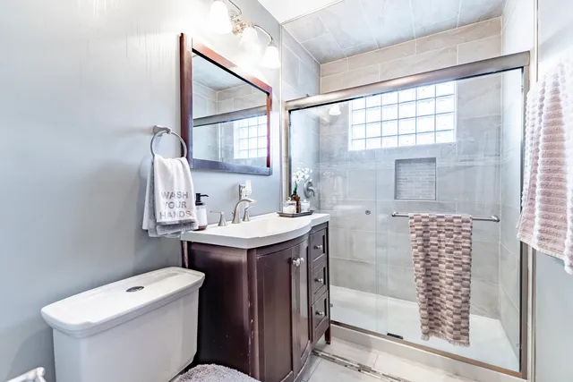 a view of a hallway with furniture and staircase