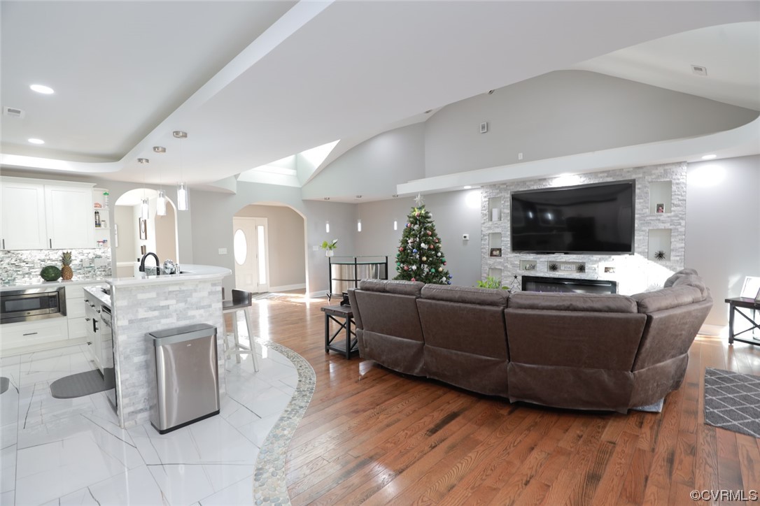 2420 Aberdeen Road Richmond, VA 23237 - Photo 15 of 50 a living room with furniture a flat screen tv and a fireplace