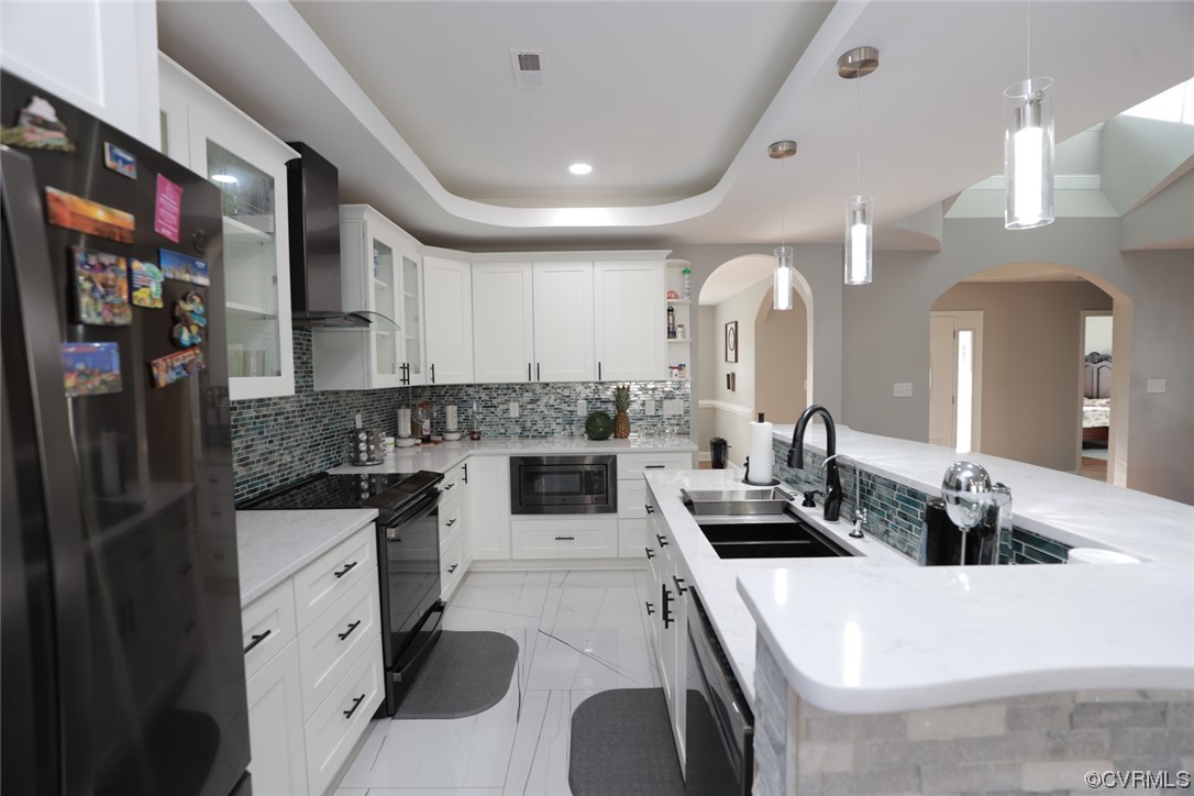 2420 Aberdeen Road Richmond, VA 23237 - Photo 19 of 50 a kitchen with a sink a stove and cabinets