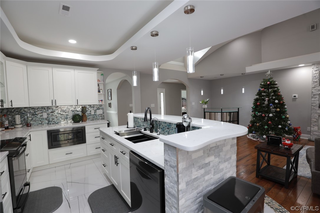 2420 Aberdeen Road Richmond, VA 23237 - Photo 25 of 50 a kitchen with a sink stove and cabinets