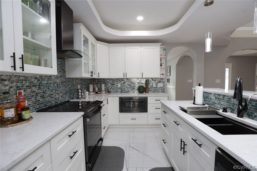 2420 Aberdeen Road Richmond, VA 23237 - Photo 26 of 50 a kitchen with a sink stove and cabinets