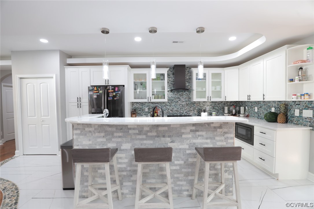 2420 Aberdeen Road Richmond, VA 23237 - Photo 27 of 50 a large white kitchen island with a sink and large window