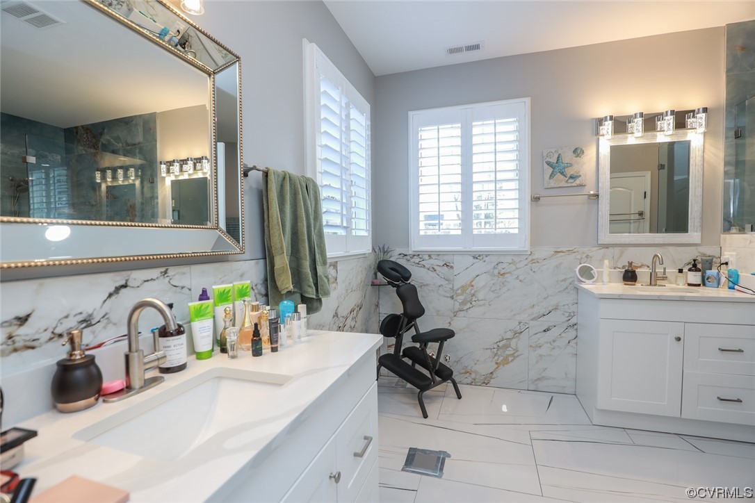 2420 Aberdeen Road Richmond, VA 23237 - Photo 34 of 50 a bathroom with a sink double vanity and a tub