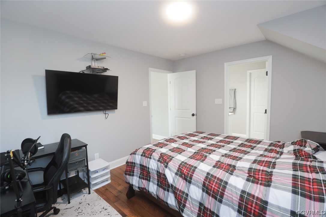 2420 Aberdeen Road Richmond, VA 23237 - Photo 36 of 50 a bedroom with a bed and a flat screen tv