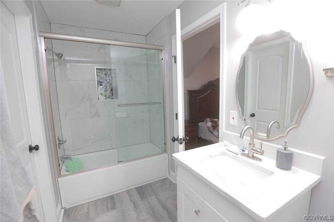 2420 Aberdeen Road Richmond, VA 23237 - Photo 37 of 50 a bathroom with a sink a mirror and a bathtub