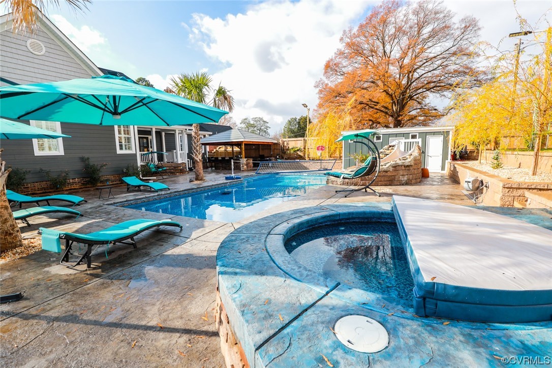 2420 Aberdeen Road Richmond, VA 23237 - Photo 49 of 50 a view of patio with table and chairs under an umbrella