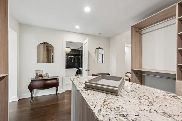 a view of a lake with couches in the patio