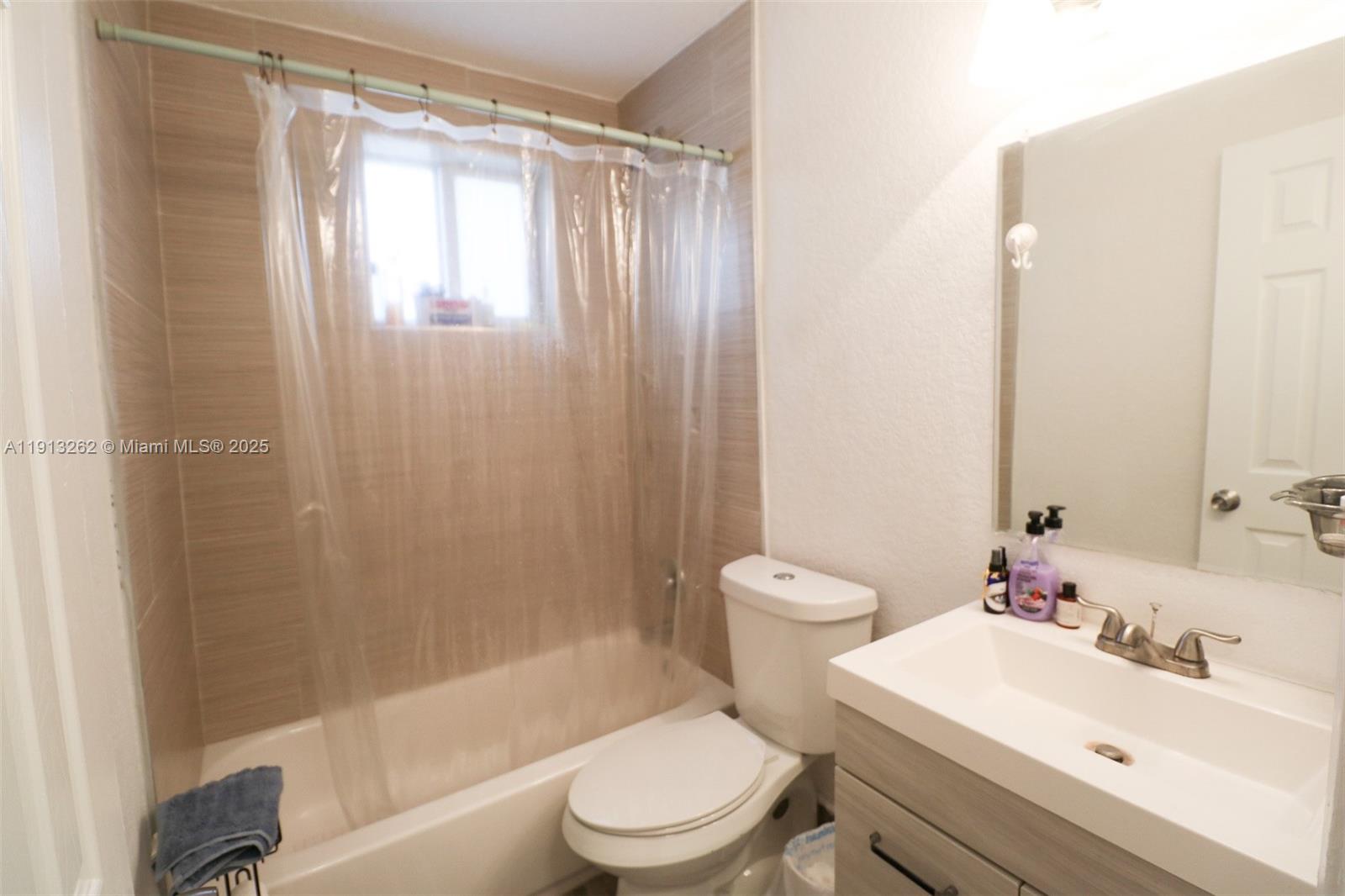 3071 Southwest 27th Avenue, Unit 5 Miami, FL 33133 - Photo 11 of 17 a bathroom with a sink toilet and shower