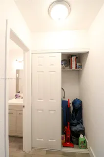 a view of hallway with washer and dryer