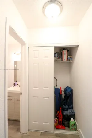 a view of hallway with washer and dryer