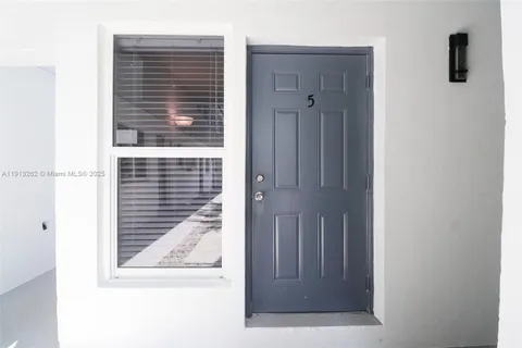 a view of a door and a window