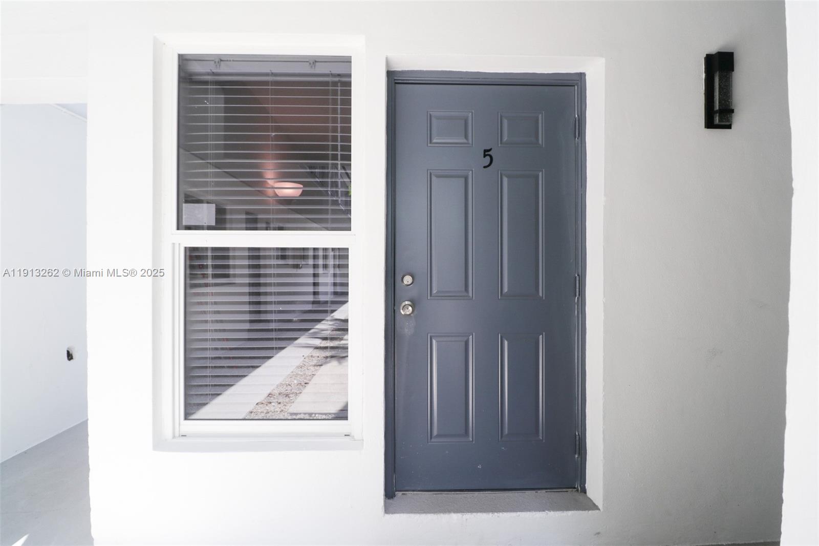 3071 Southwest 27th Avenue, Unit 5 Miami, FL 33133 - Photo 2 of 17 a view of a door and a window