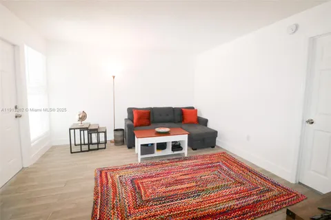 a living room with a bed and a couch
