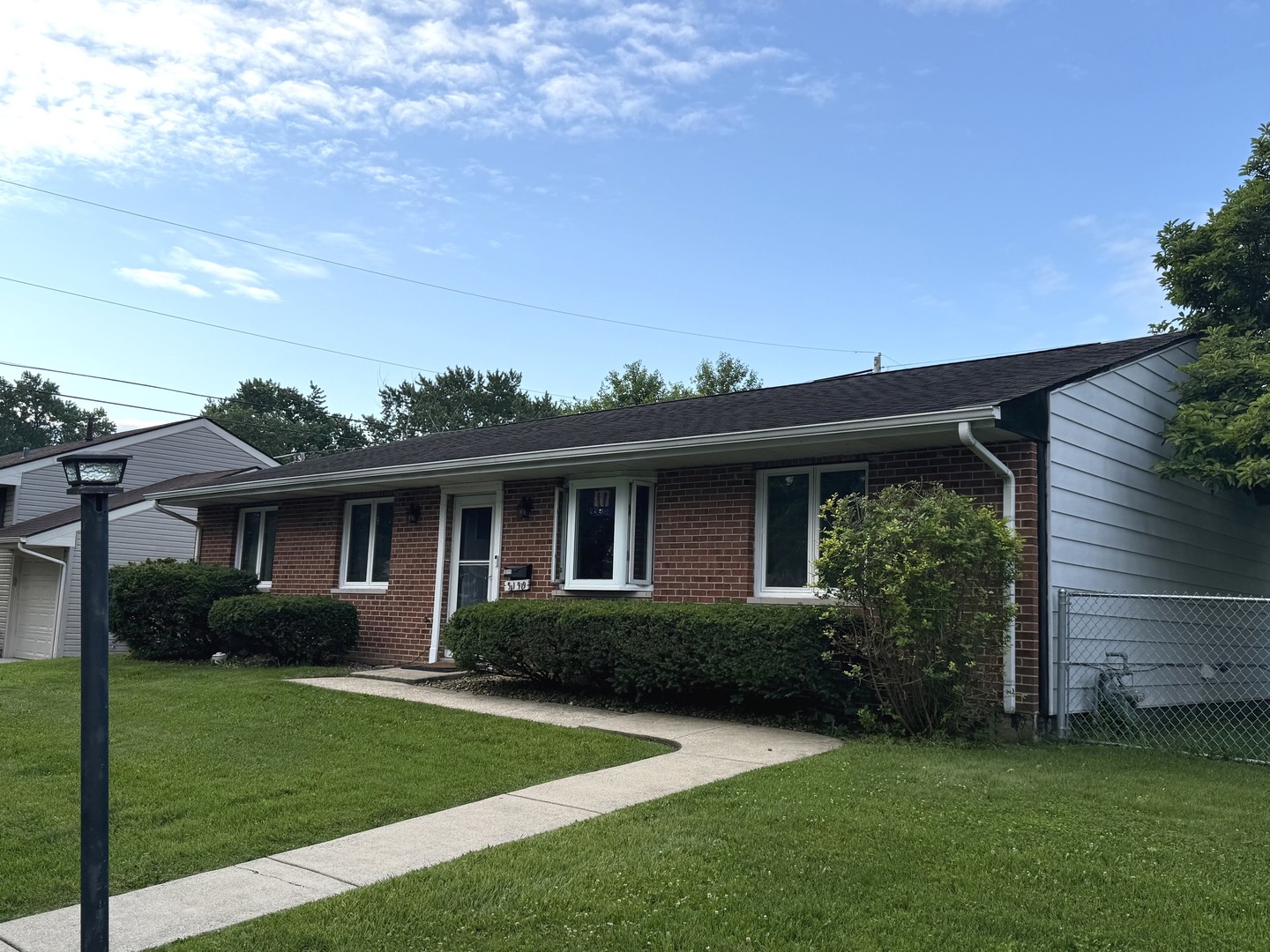 5199 Elmwood Road Oak Forest, IL 60452 - Photo 2 of 30 a front view of a house with a garden