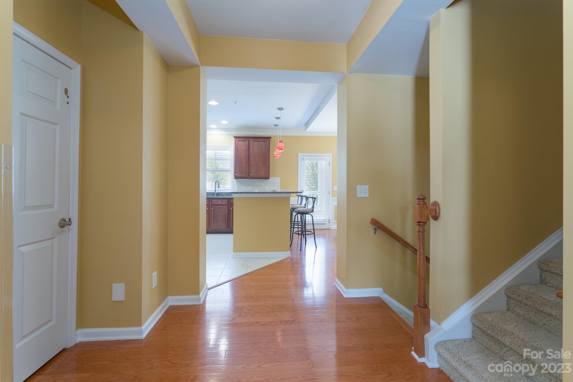 627 Sunfish Lane Tega Cay, SC 29708 - Photo 11 of 46 a view of a kitchen from the hallway