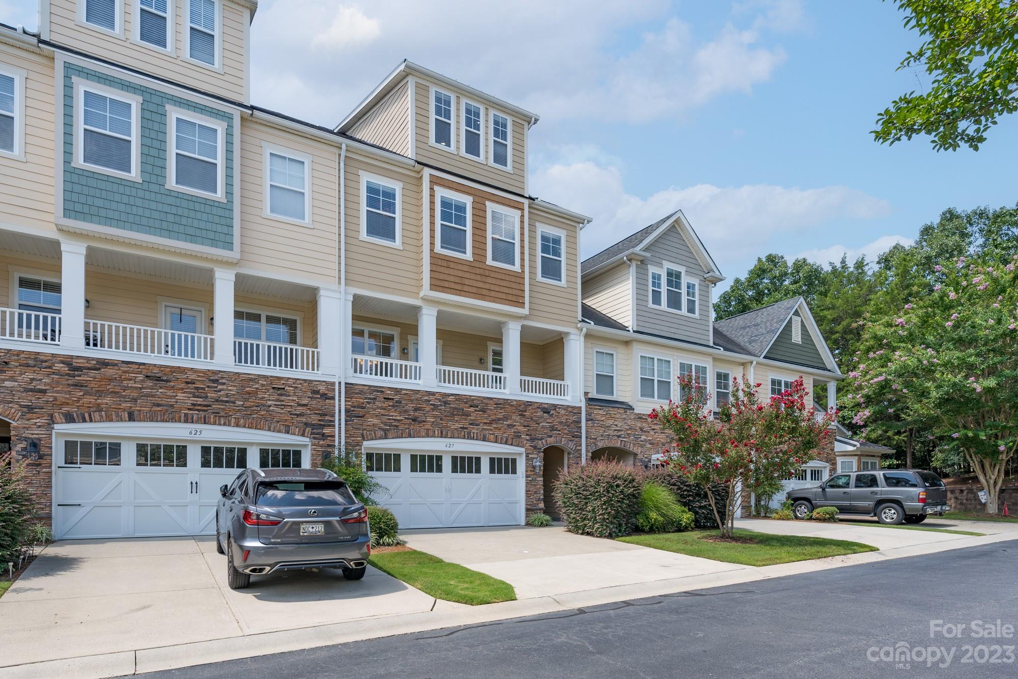 627 Sunfish Lane Tega Cay, SC 29708 - Photo 2 of 46 a car parked in front of a building