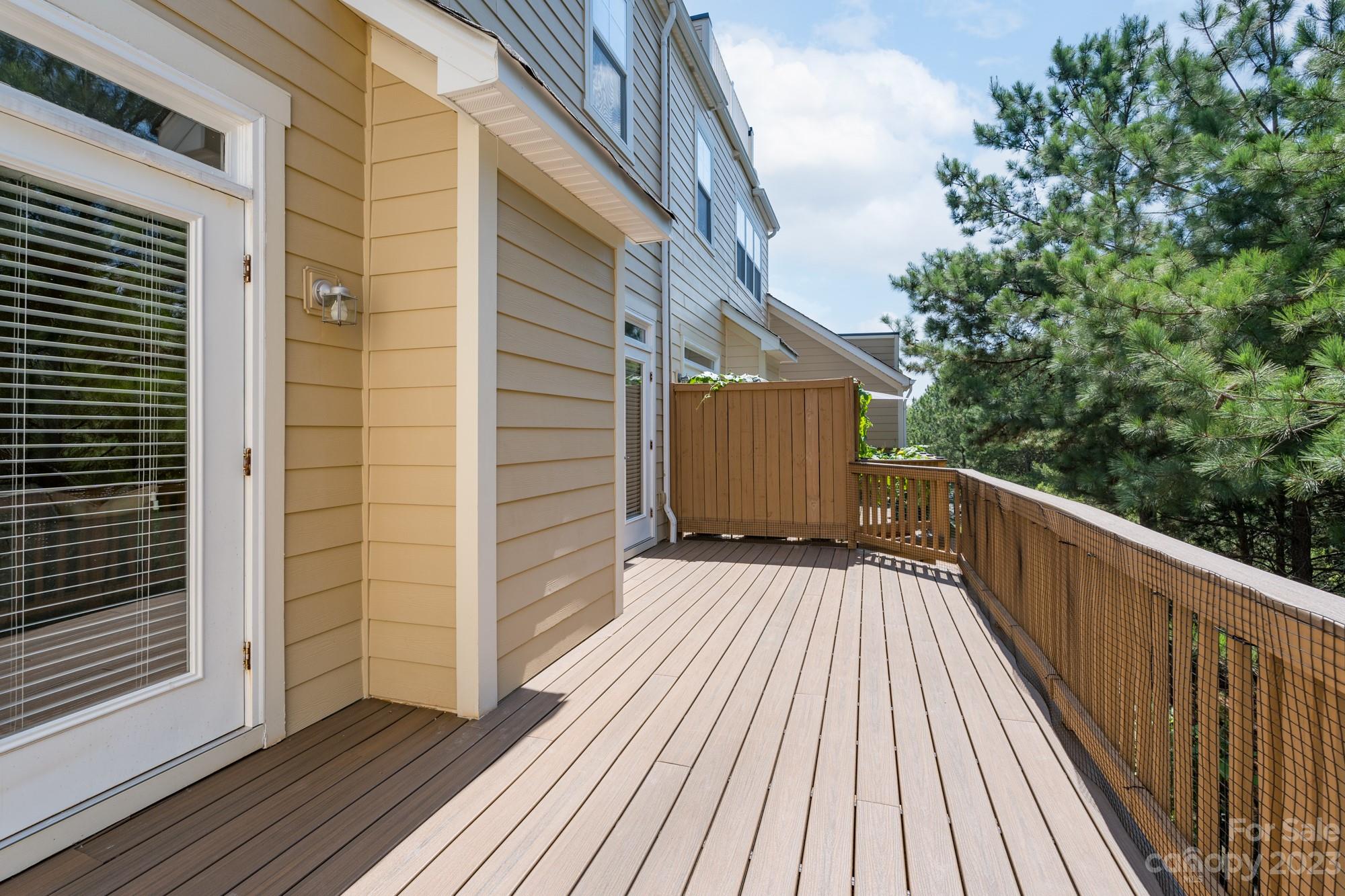 627 Sunfish Lane Tega Cay, SC 29708 - Photo 22 of 46 a view of balcony with wooden floor and fence