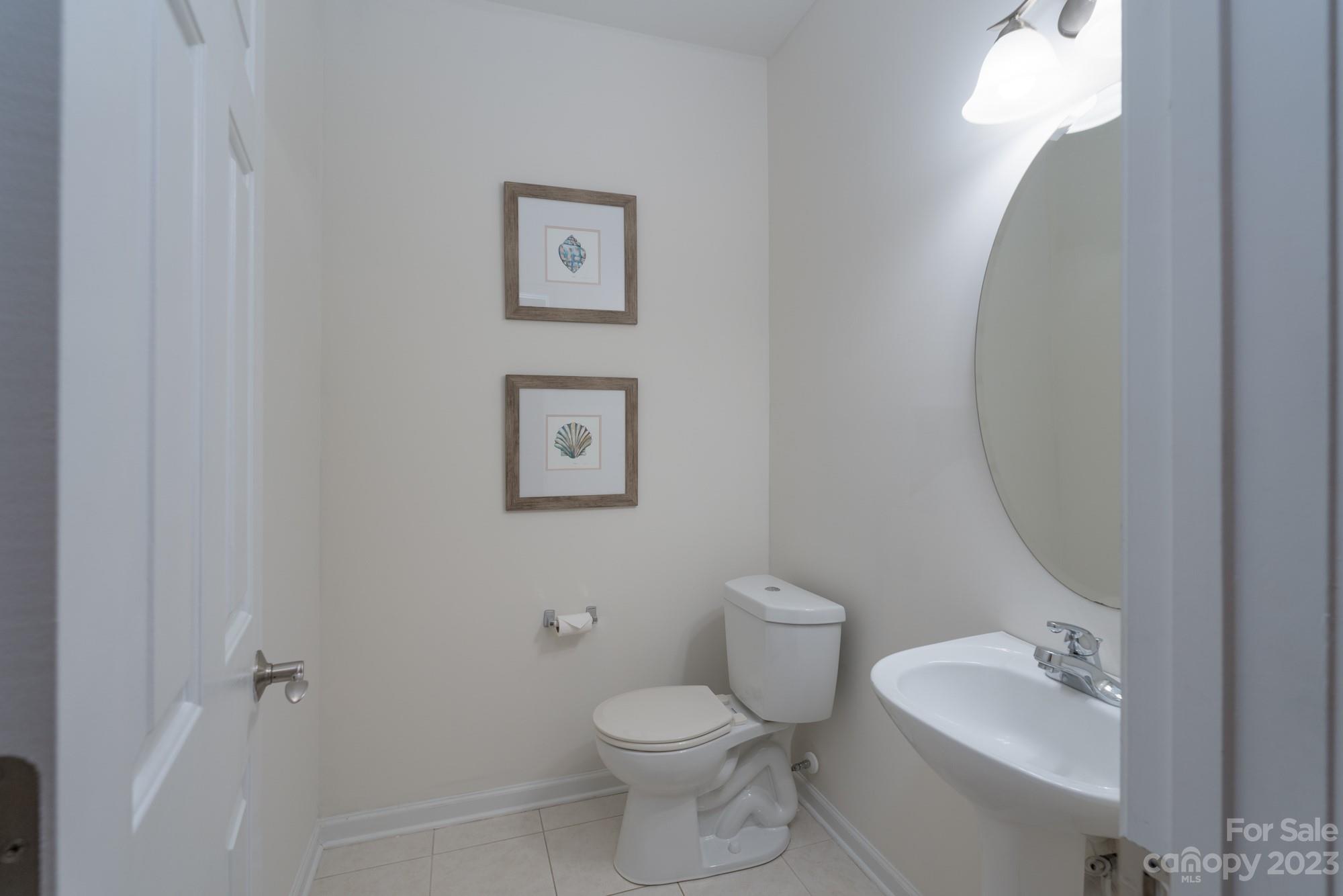 627 Sunfish Lane Tega Cay, SC 29708 - Photo 23 of 46 a bathroom with a toilet sink vanity and mirror