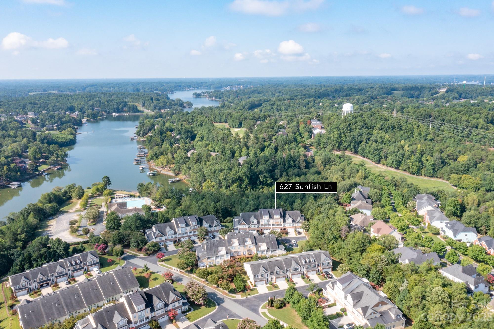 627 Sunfish Lane Tega Cay, SC 29708 - Photo 3 of 46 a view of a lake with couches and city view