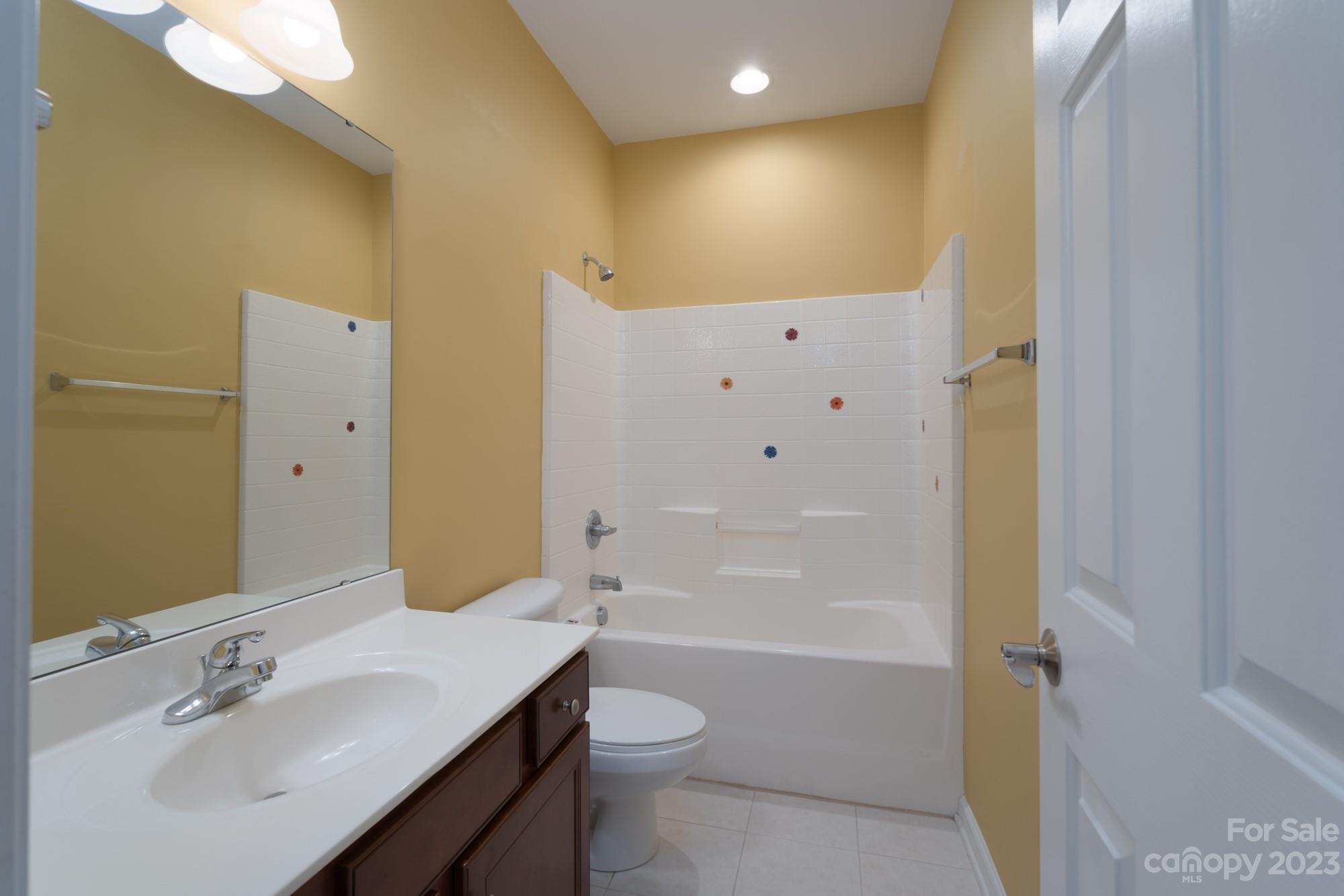 627 Sunfish Lane Tega Cay, SC 29708 - Photo 31 of 46 a bathroom with a sink a toilet and shower