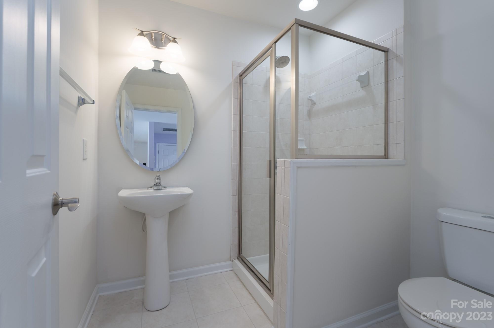 627 Sunfish Lane Tega Cay, SC 29708 - Photo 37 of 46 a bathroom with a toilet sink and mirror