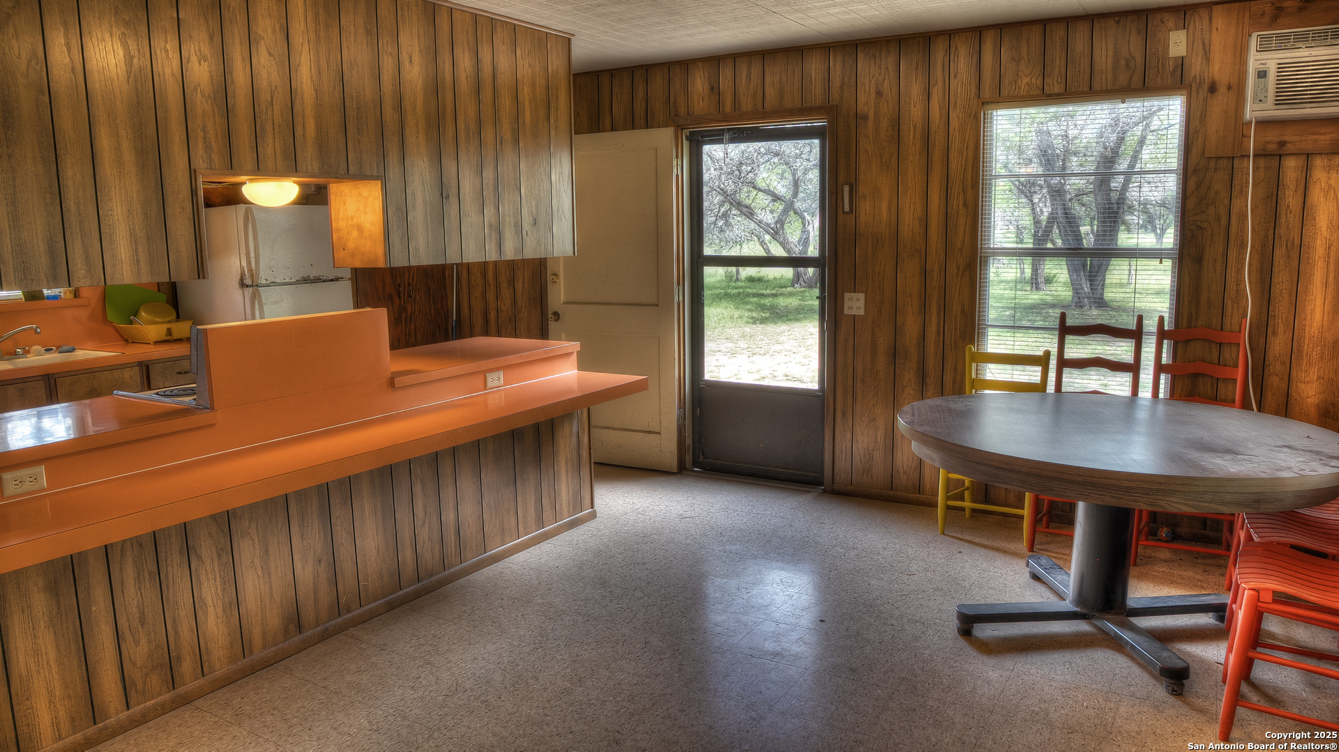 154 Weston Road Leakey, TX 78873 - Photo 19 of 39 a dining room with a window table and chairs