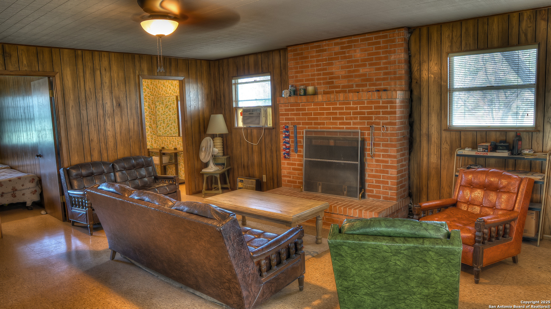 154 Weston Road Leakey, TX 78873 - Photo 21 of 39 an outdoor living room with furniture stove and wooden floor
