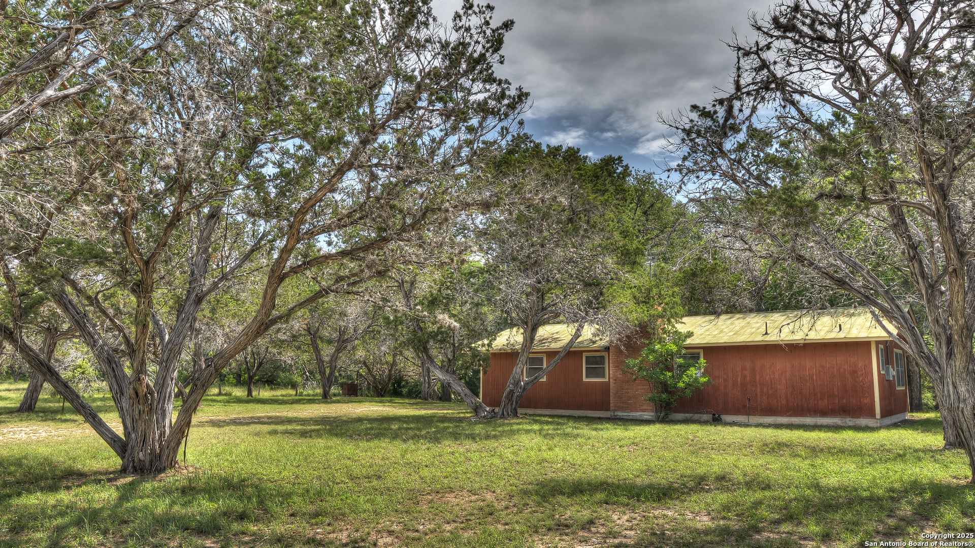 154 Weston Road Leakey, TX 78873 - Photo 3 of 39 a view of a trees in front of a house
