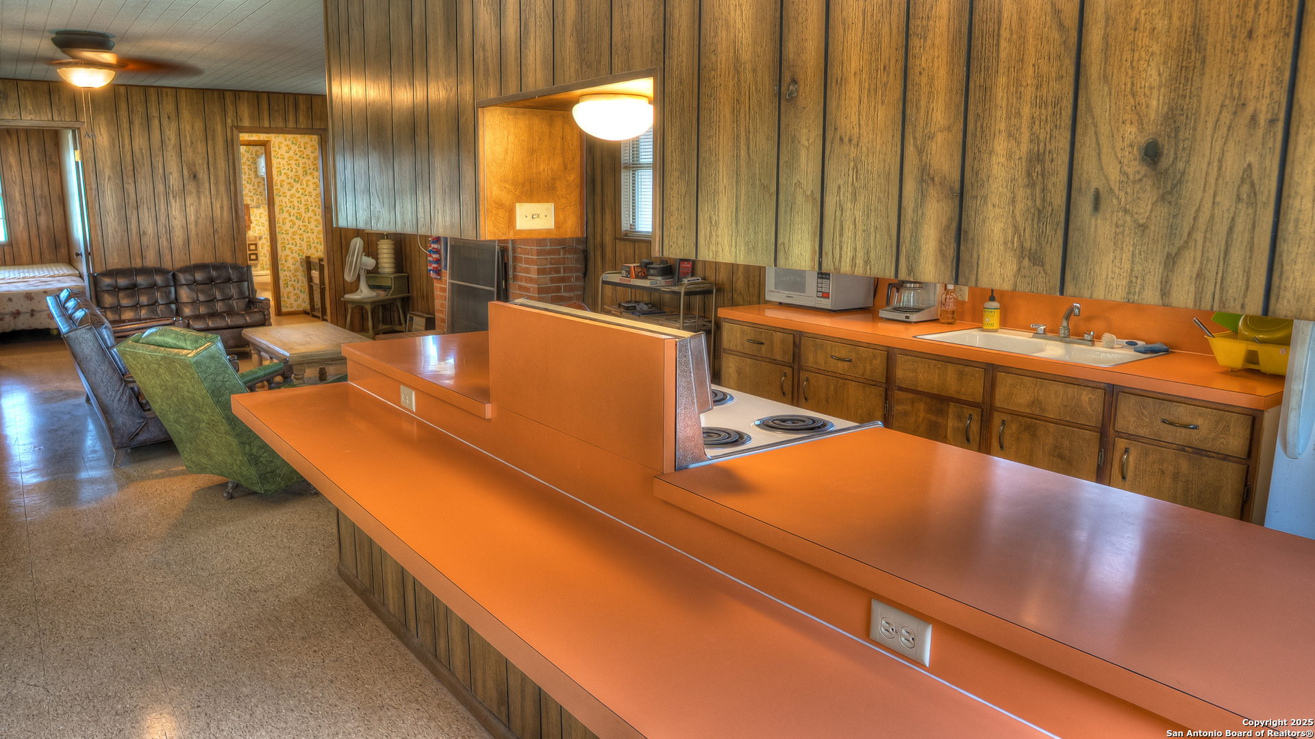 154 Weston Road Leakey, TX 78873 - Photo 31 of 39 a view of a kitchen with kitchen island a sink and a large window