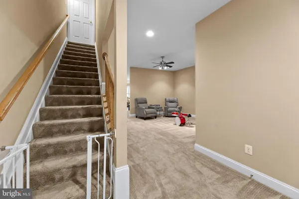 a bed room with a bed and a ceiling fan