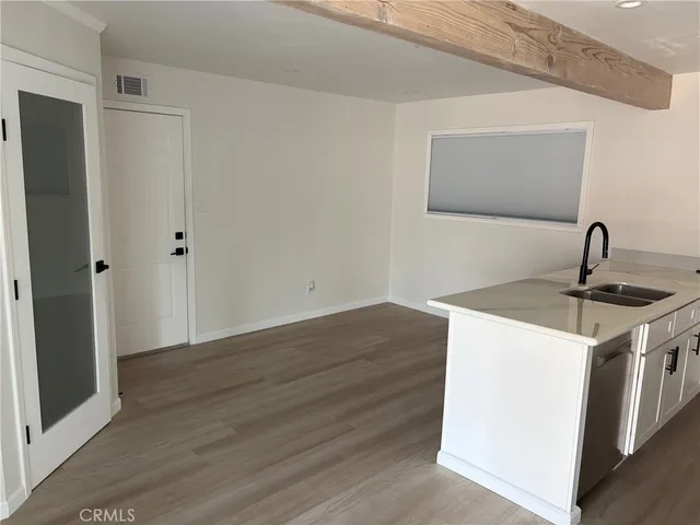 a kitchen with a sink and a refrigerator