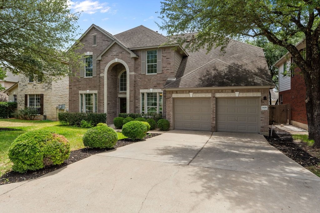 7609 Seneca Falls Loop Austin, TX 78739 - Photo 1 of 1 a front view of a house with garden