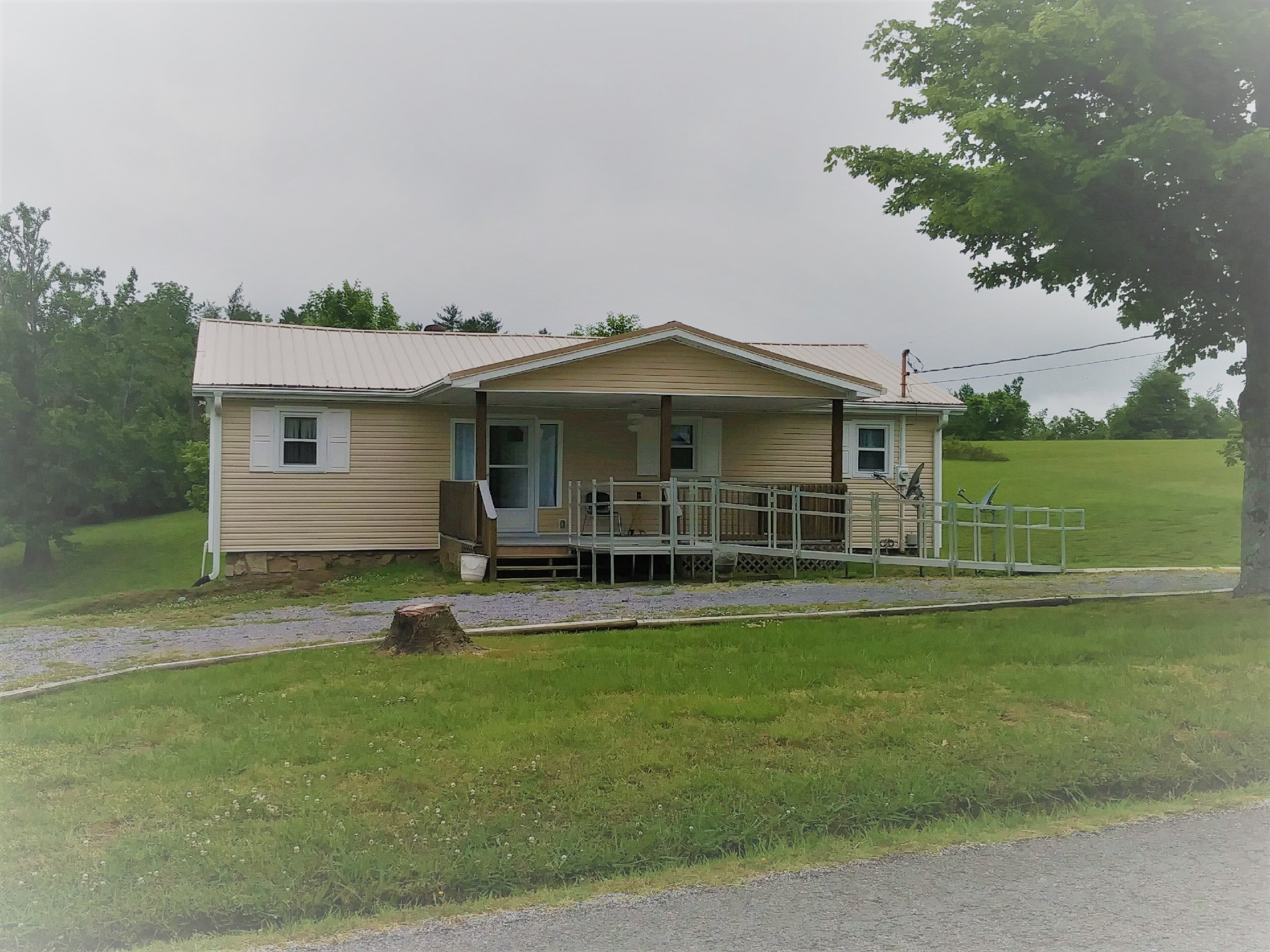 258 Union Ridge Road Wartrace, TN 37183 - Photo 3 of 25 a view of a house with a yard and sitting area