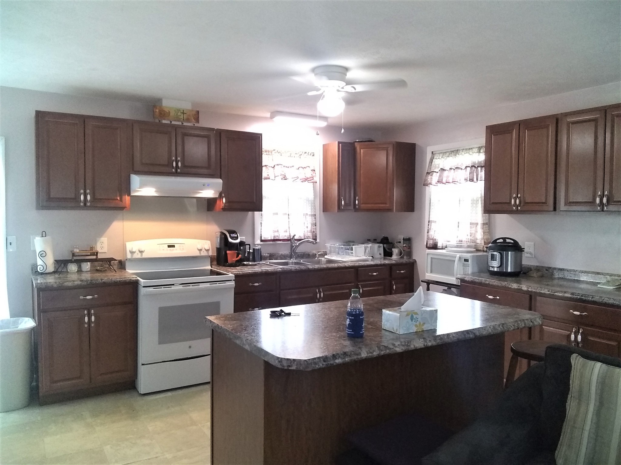 258 Union Ridge Road Wartrace, TN 37183 - Photo 5 of 25 a kitchen with granite countertop a sink a stove and cabinets