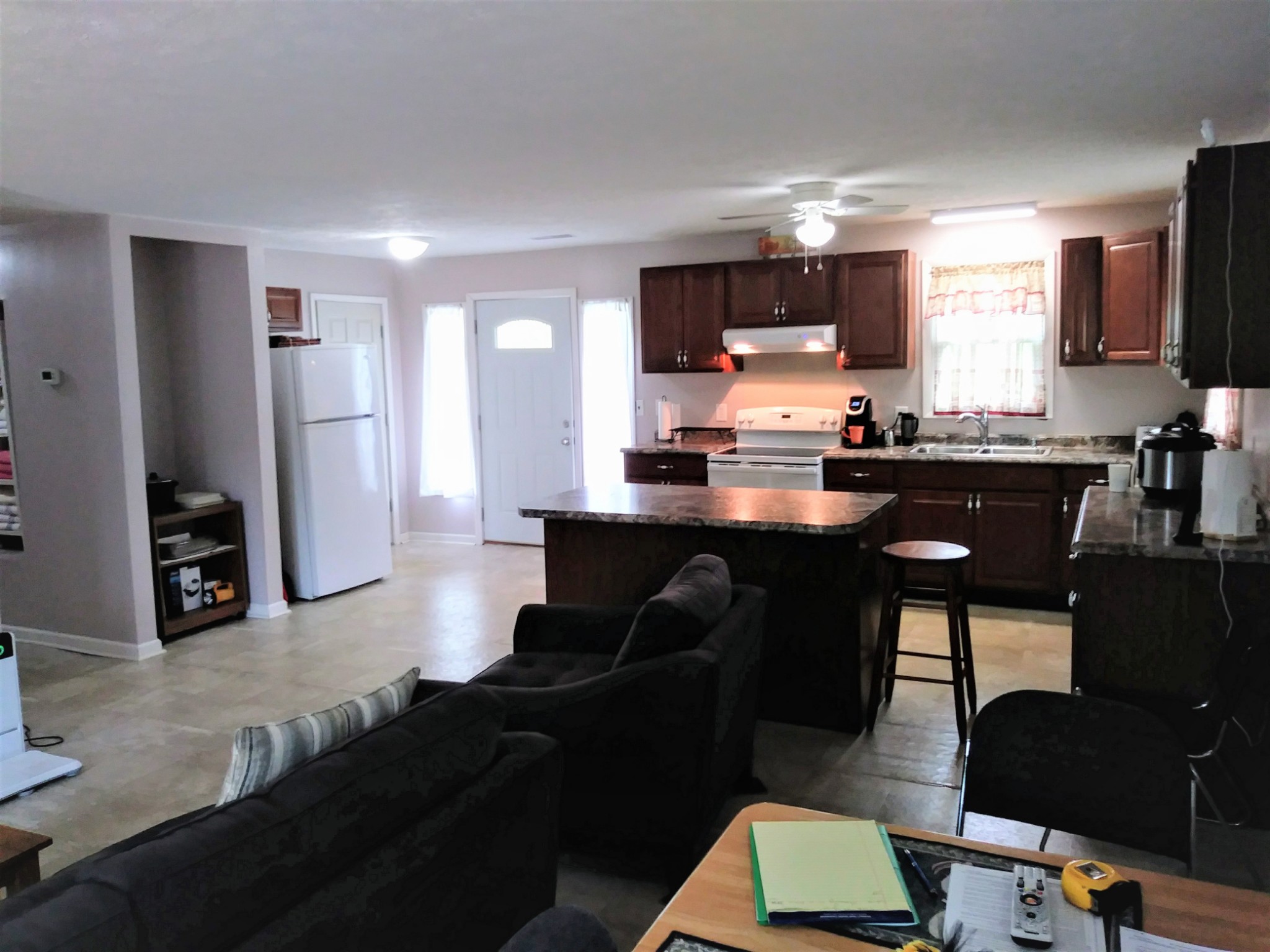 258 Union Ridge Road Wartrace, TN 37183 - Photo 7 of 25 a kitchen with a table chairs refrigerator and microwave