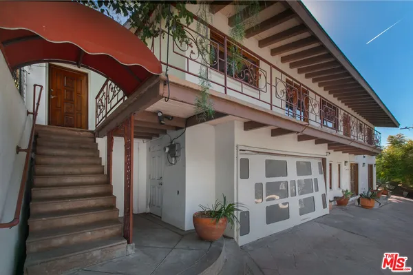 a front view of a building with street view