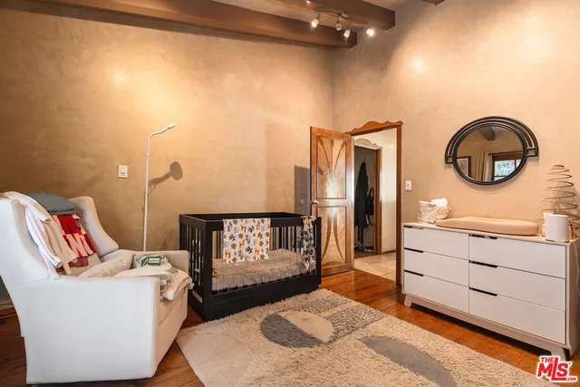 a bathroom with a sink mirror vanity and toilet