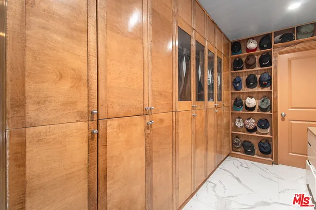 a bathroom with a double vanity sink toilet and shower