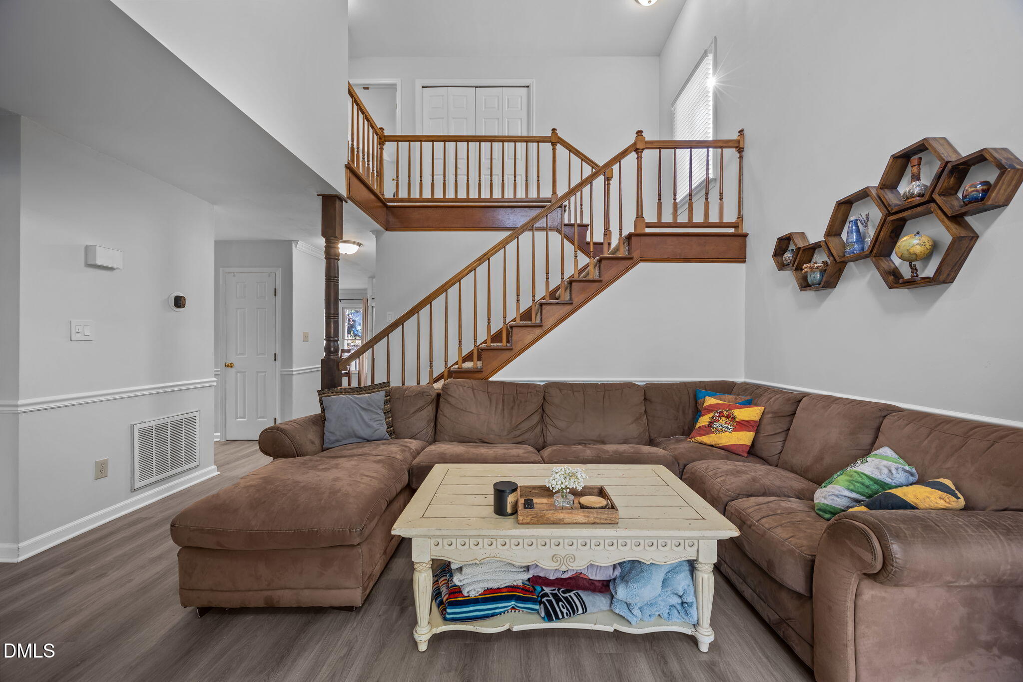 4952 Liverpool Lane Raleigh, NC 27604 - Photo 14 of 44 a living room with furniture and stairs