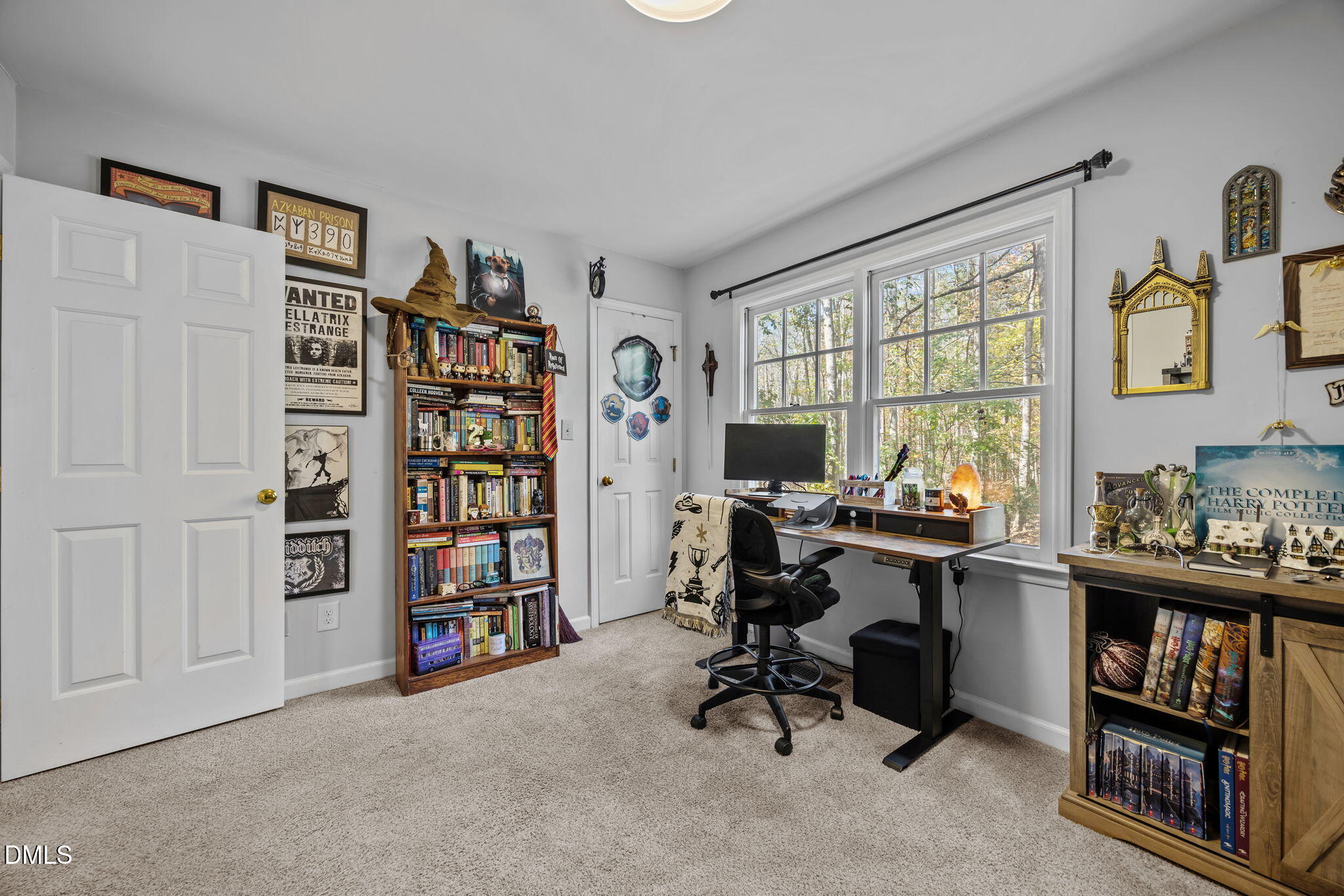 4952 Liverpool Lane Raleigh, NC 27604 - Photo 18 of 44 a view of a workspace with bookshelf and a window