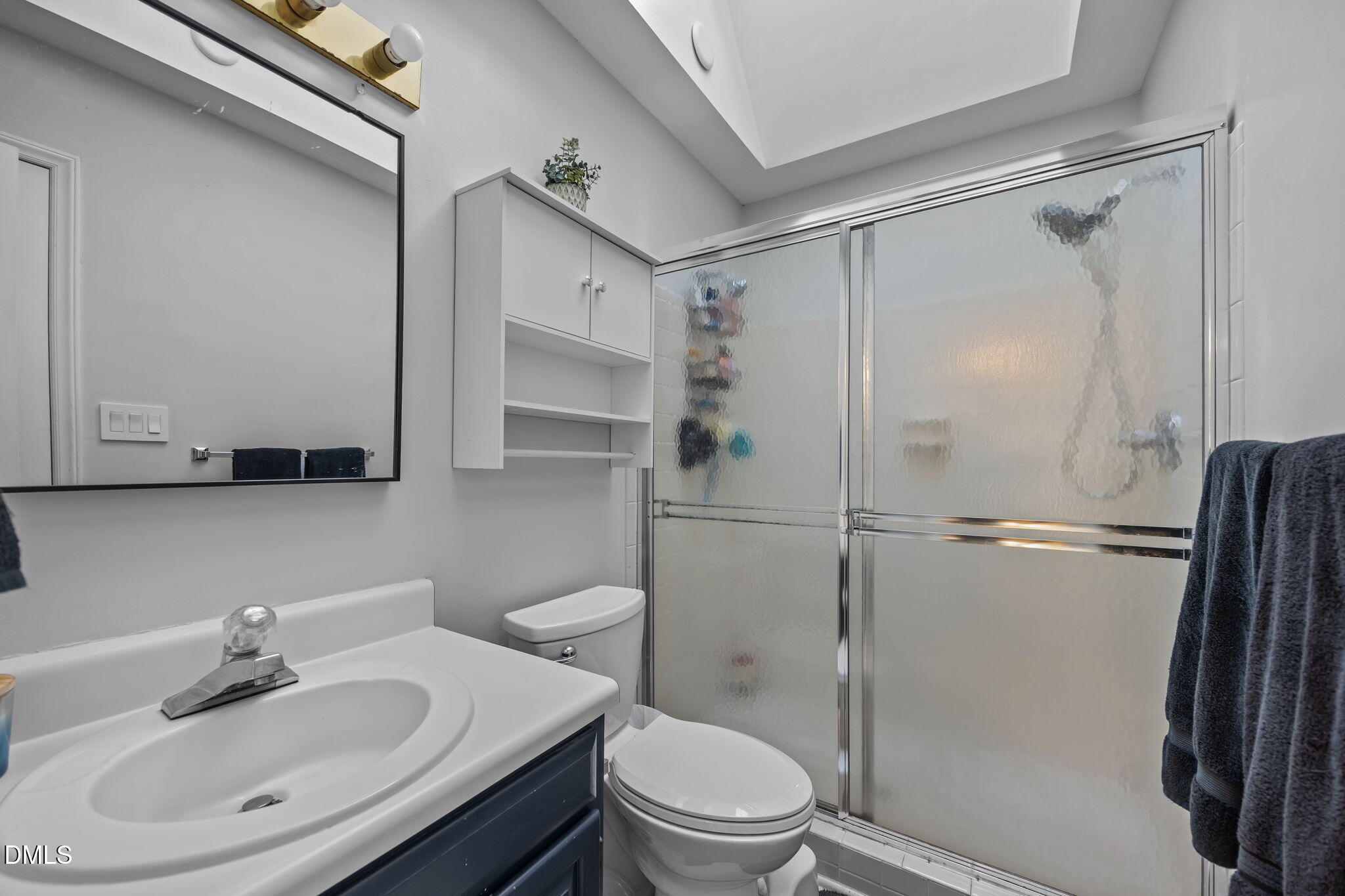 4952 Liverpool Lane Raleigh, NC 27604 - Photo 20 of 44 a bathroom with a sink toilet and shower