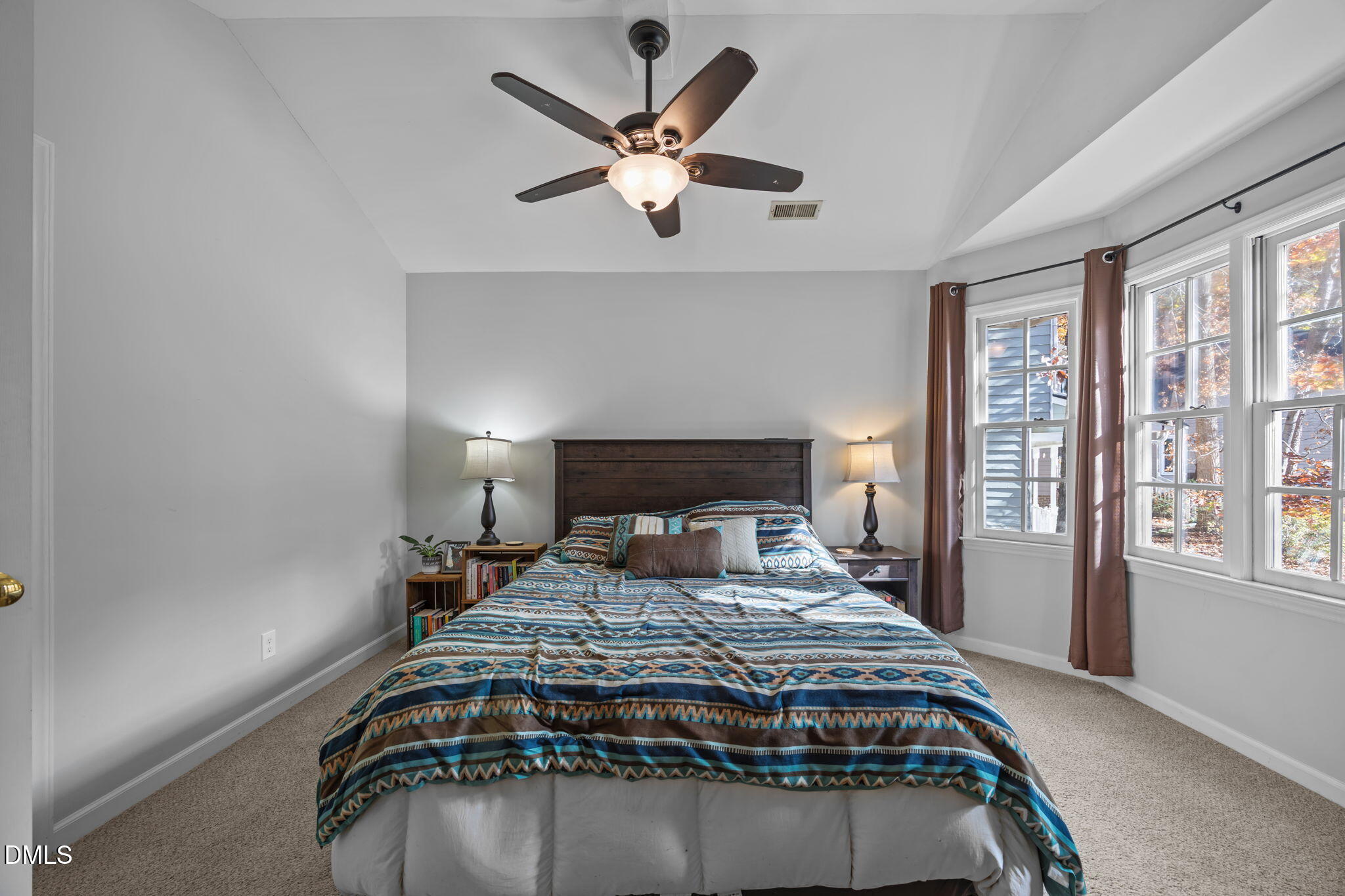 4952 Liverpool Lane Raleigh, NC 27604 - Photo 21 of 44 a bedroom with a large bed and a large window