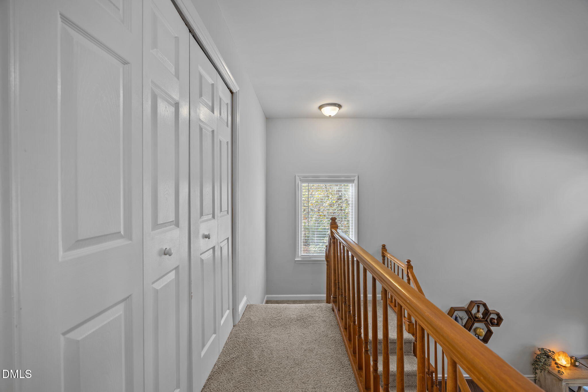 4952 Liverpool Lane Raleigh, NC 27604 - Photo 25 of 44 a view of a hallway with wooden floor and entryway
