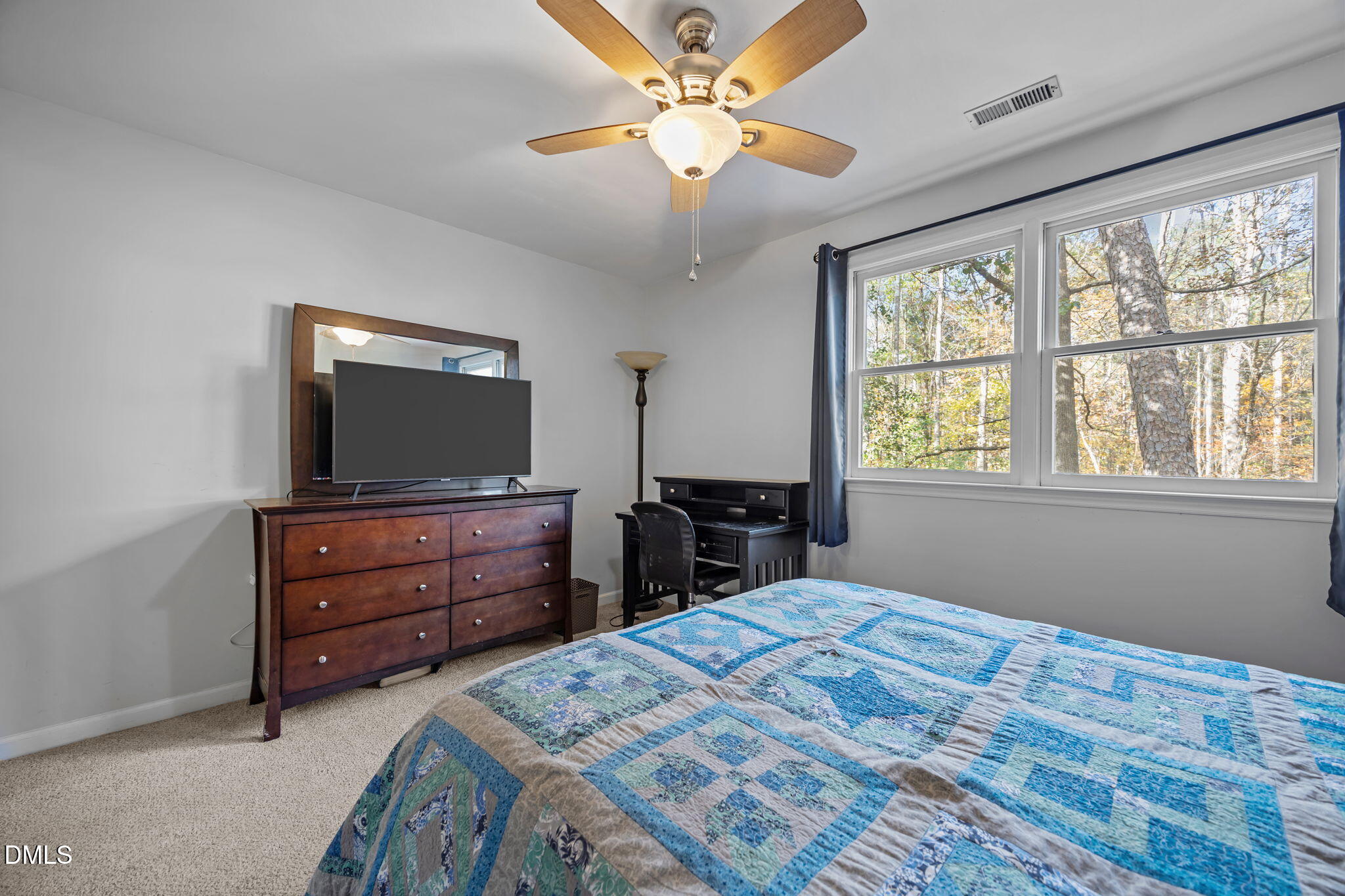 4952 Liverpool Lane Raleigh, NC 27604 - Photo 28 of 44 a bedroom with a bed and a flat screen tv